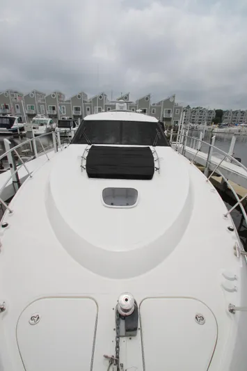 Yacht Photos Pics 2016 Sea Ray 510 Sundancer yacht docked at marina, overcast sky.