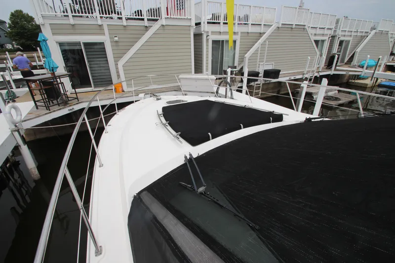  Yacht Photos Pics 2016 Sea Ray 510 Sundancer yacht docked at marina, featuring spacious deck and modern design.