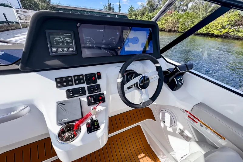  Yacht Photos Pics Cockpit of 2025 STERK 31 boat with modern controls and navigation displays.