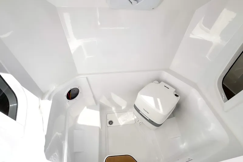  Yacht Photos Pics Compact bathroom in 2025 STERK 31 boat with modern white fixtures.
