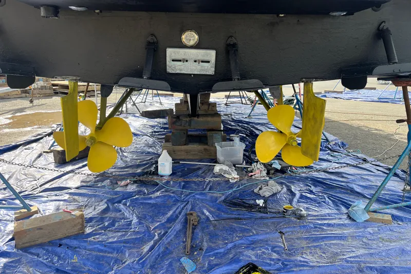 Sea Wolf Yacht Photos Pics 1994 Bayliner 4788 Pilot House Motoryacht with yellow propellers on a tarp.