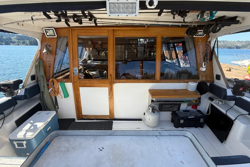 Sea Wolf Yacht Photos Pics 1994 Bayliner 4788 Pilot House Motoryacht interior with wooden doors and lake view.