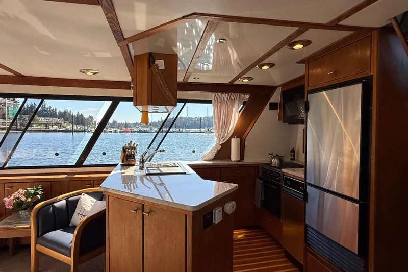 Sea Wolf Yacht Photos Pics Luxurious 1994 Bayliner 4788 Pilot House Motoryacht kitchen with scenic water views.