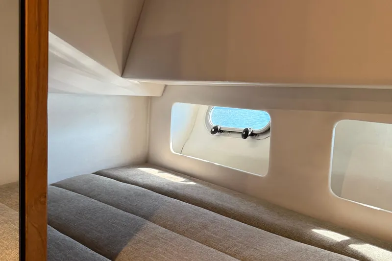 Sea Wolf Yacht Photos Pics Cozy cabin interior of 1994 Bayliner 4788 Pilot House Motoryacht with window view.