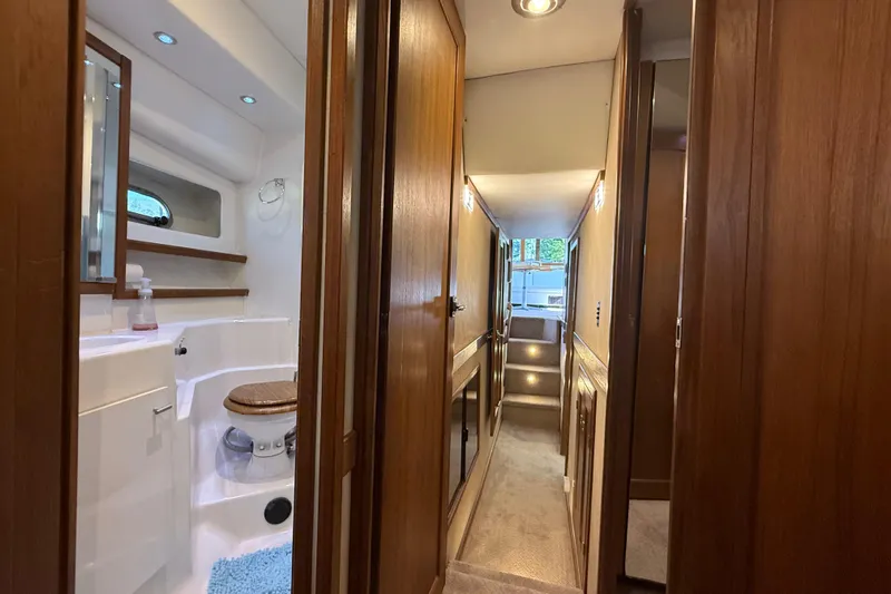 Sea Wolf Yacht Photos Pics 1994 Bayliner 4788 Pilot House Motoryacht interior hallway with bathroom view.
