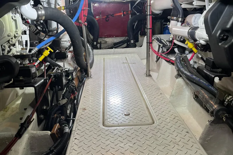 Sea Wolf Yacht Photos Pics Engine room of 1994 Bayliner 4788 Pilot House Motoryacht, showcasing mechanical components.