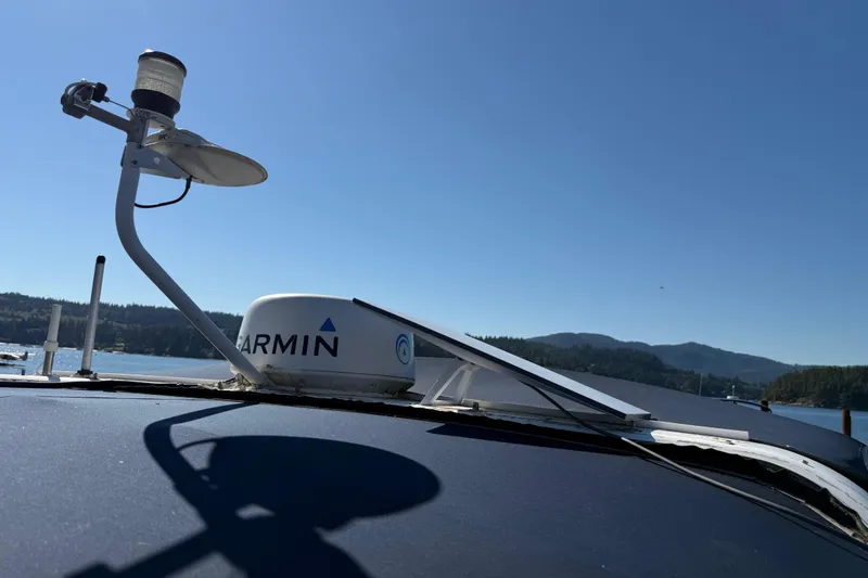 Sea Wolf Yacht Photos Pics 1994 Bayliner 4788 Pilot House Motoryacht with Garmin radar on a sunny day.