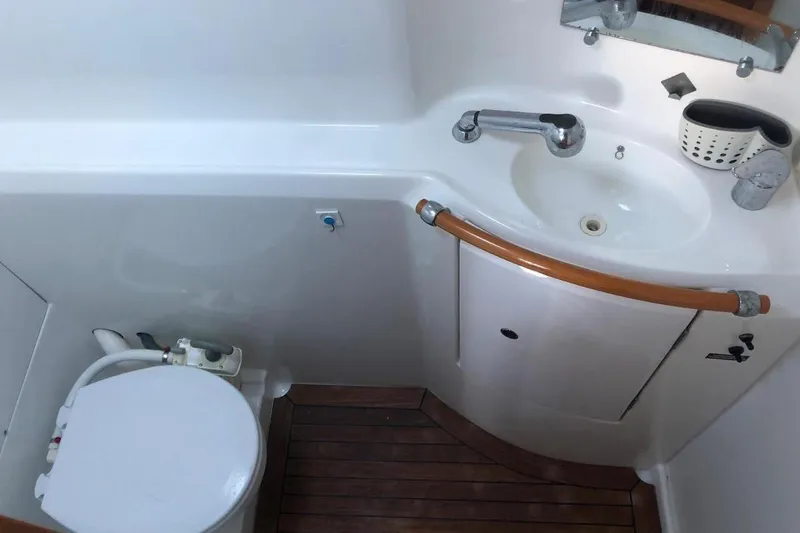 Alego Yacht Photos Pics Compact bathroom in 2007 Lagoon 380 S2 yacht with sink and toilet.