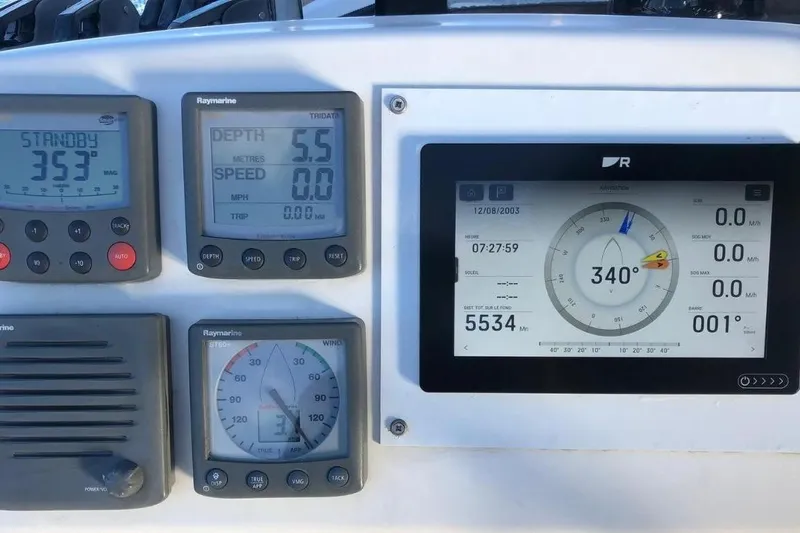 Alego Yacht Photos Pics Control panel of a 2007 Lagoon 380 S2 catamaran with navigation instruments.