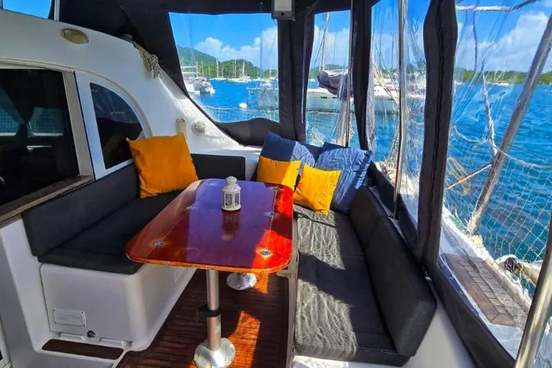 Alego Yacht Photos Pics Interior of 2007 Lagoon 380 S2 yacht with cozy seating and ocean view.