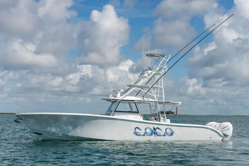  Yacht Photos Pics 2019 Yellowfin 42 Center Console boat on water under cloudy sky.