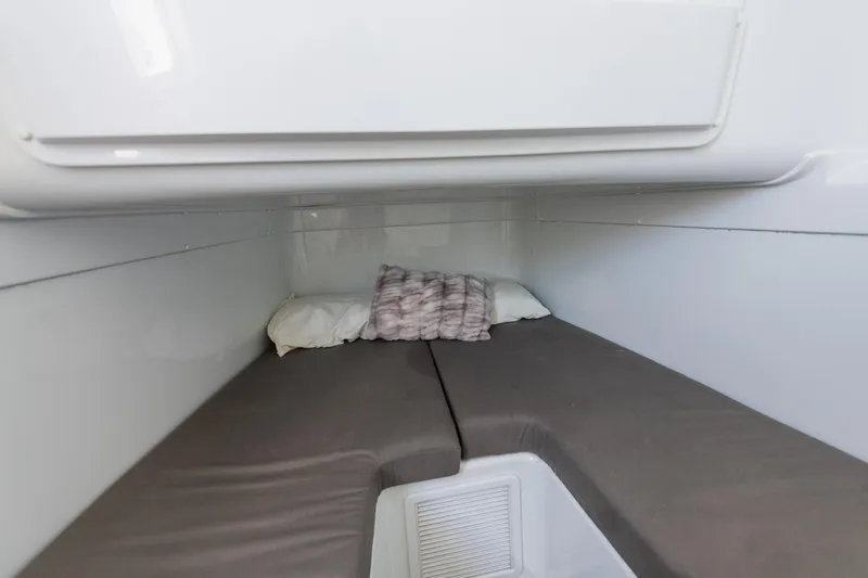  Yacht Photos Pics 2019 Yellowfin 42 Center Console cabin interior with cozy bedding.