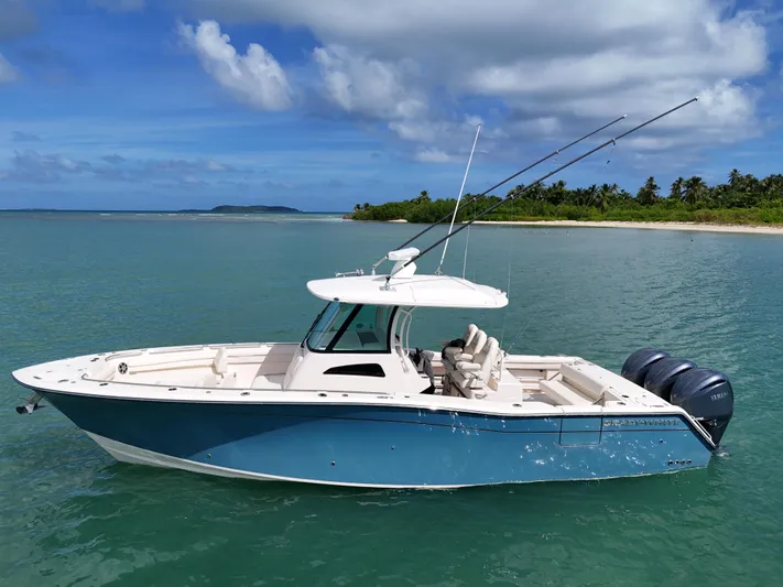  Yacht Photos Pics 2021 Grady-White Canyon 336 boat on calm tropical waters.