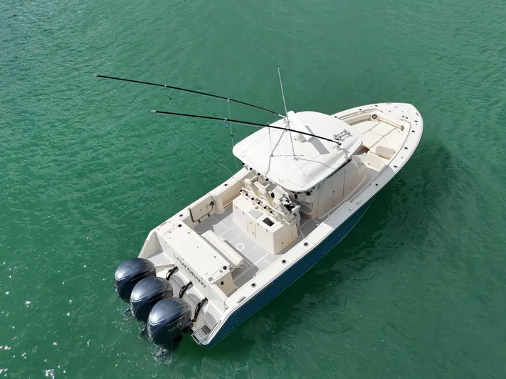  Yacht Photos Pics 2021 Grady-White Canyon 336 boat on clear water, aerial view.