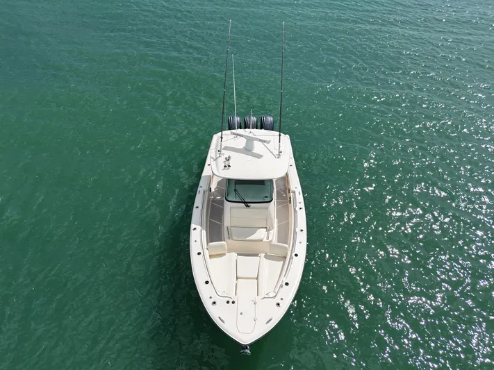  Yacht Photos Pics 2021 Grady-White Canyon 336 boat on clear green water, aerial view.