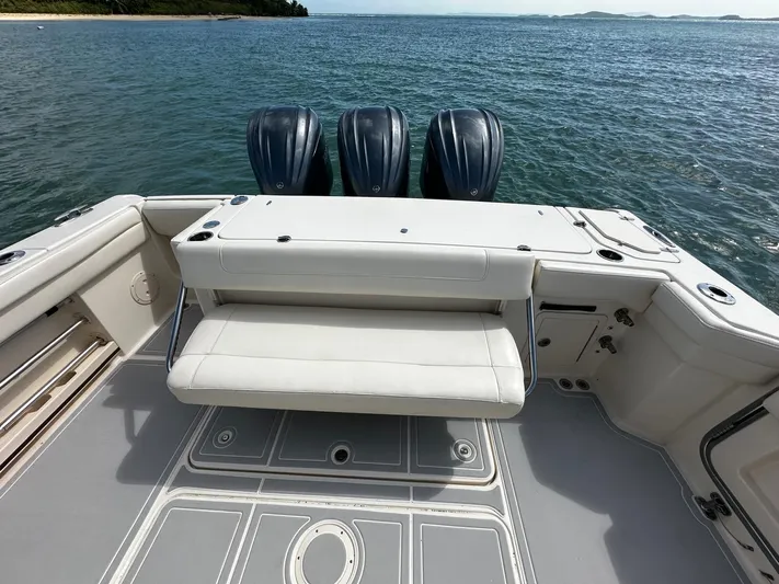  Yacht Photos Pics 2021 Grady-White Canyon 336 boat with triple engines on open water.