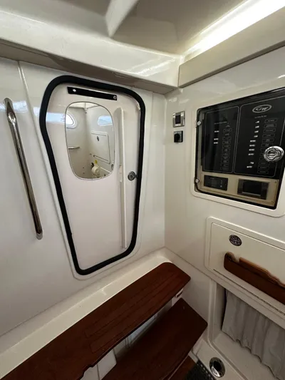  Yacht Photos Pics Interior of 2021 Grady-White Canyon 336 boat, featuring control panel and cabin door.