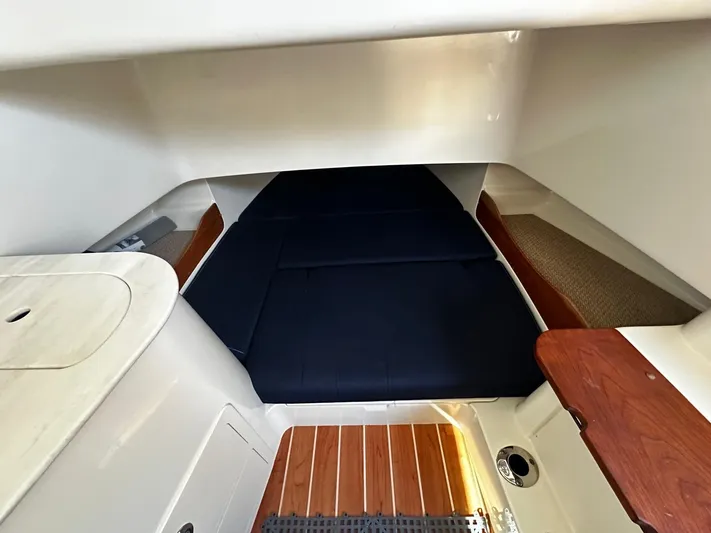  Yacht Photos Pics Interior cabin of 2021 Grady-White Canyon 336 with wood accents and cushioned seating.