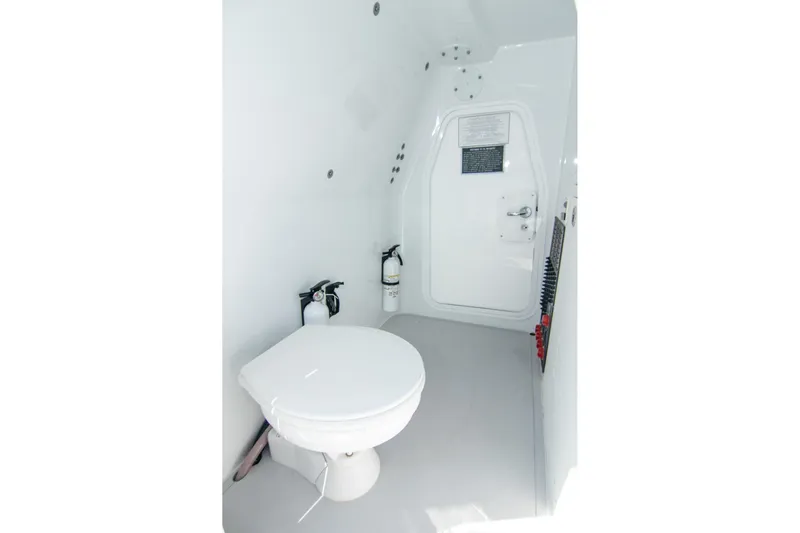  Yacht Photos Pics 2022 Freeman 37 VH boat interior with toilet and fire extinguisher.