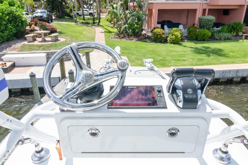  Yacht Photos Pics Helm of 2022 Freeman 37 VH boat with steering wheel and controls.