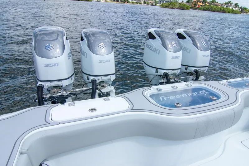 Yacht Photos Pics Four Suzuki 350 engines on a 2022 Freeman 37 VH boat, docked on water.
