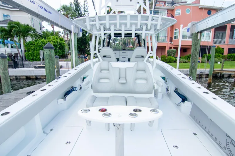  Yacht Photos Pics 2022 Freeman 37 VH boat interior with white seating and fishing rod holders.