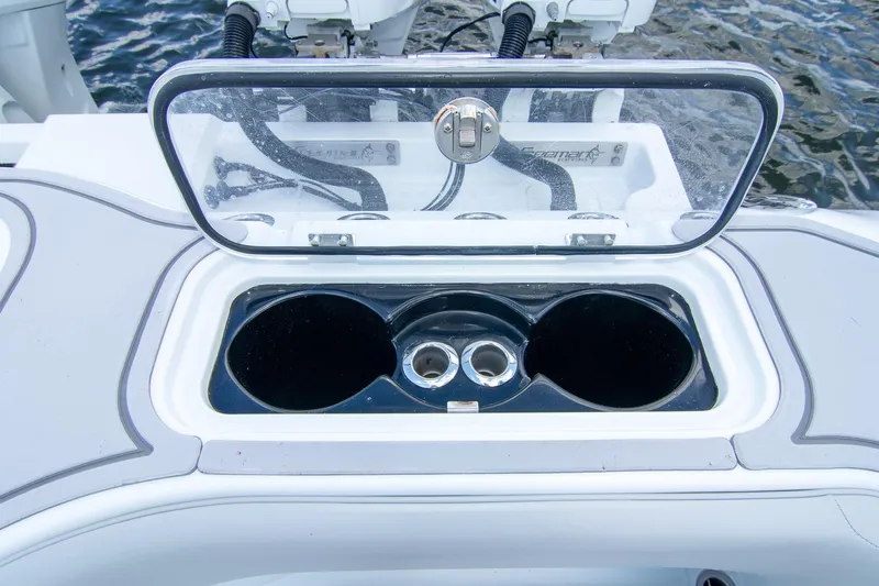  Yacht Photos Pics Open storage compartment on 2022 Freeman 37 VH boat, featuring cup holders and a clear lid.