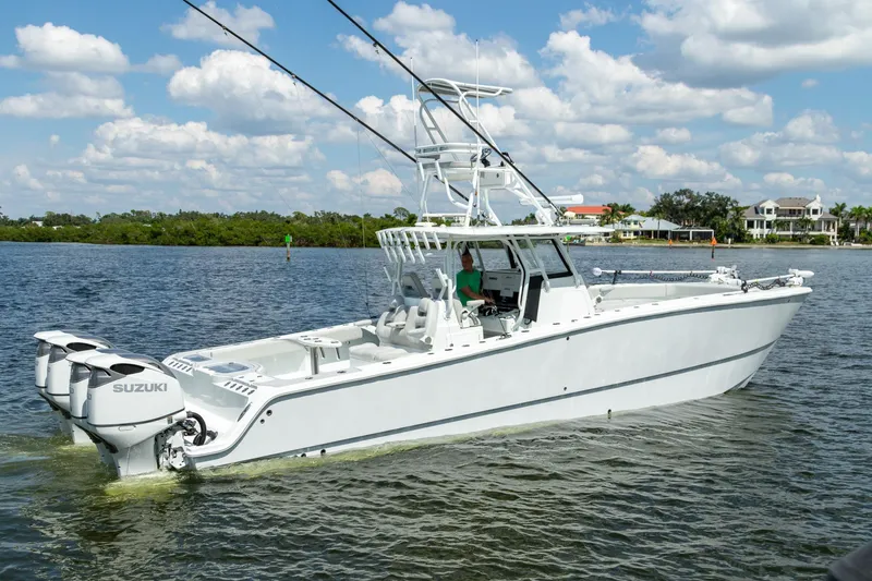  Yacht Photos Pics 2022 Freeman 37 VH boat on water with Suzuki engines, clear sky background.