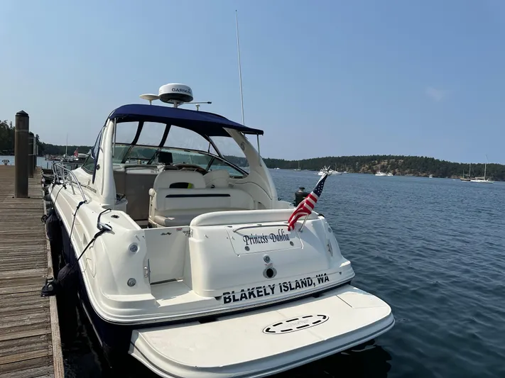  Yacht Photos Pics 2004 Sea Ray 360 Sundancer docked at Blakely Island, WA, with American flag.