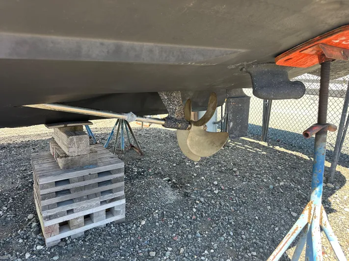  Yacht Photos Pics 2004 Sea Ray 360 Sundancer propeller and hull on dry dock with support stands.