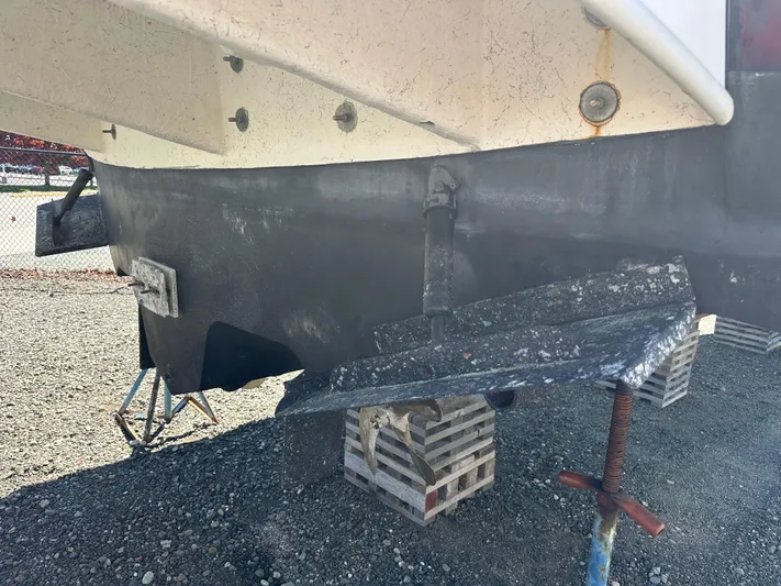  Yacht Photos Pics 2004 Sea Ray 360 Sundancer boat hull on dry dock, supported by blocks.