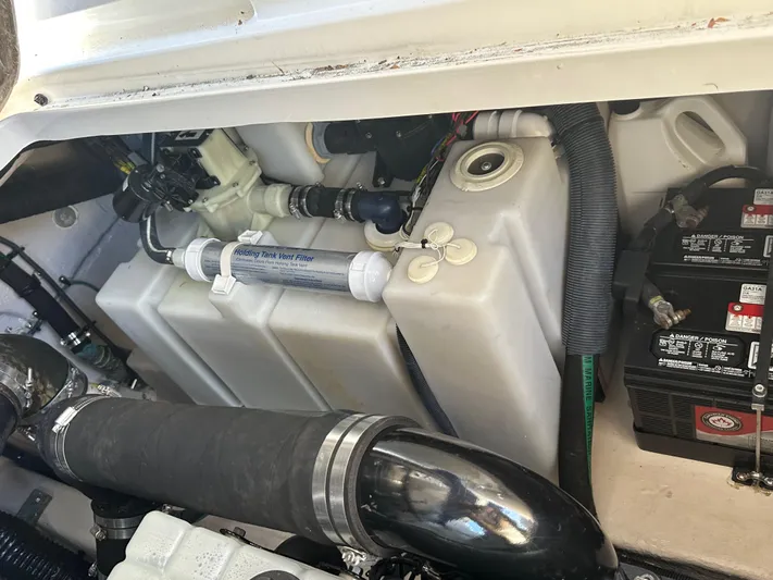  Yacht Photos Pics Engine compartment of a 2004 Sea Ray 360 Sundancer boat, showing components and battery.