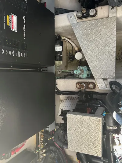  Yacht Photos Pics Engine compartment of a 2004 Sea Ray 360 Sundancer with visible components and metal plating.