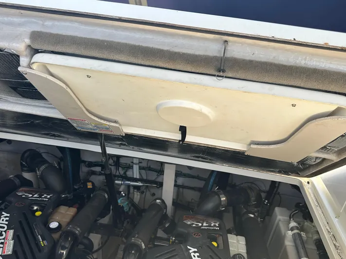  Yacht Photos Pics Engine compartment of a 2004 Sea Ray 360 Sundancer boat, featuring Mercury engines.