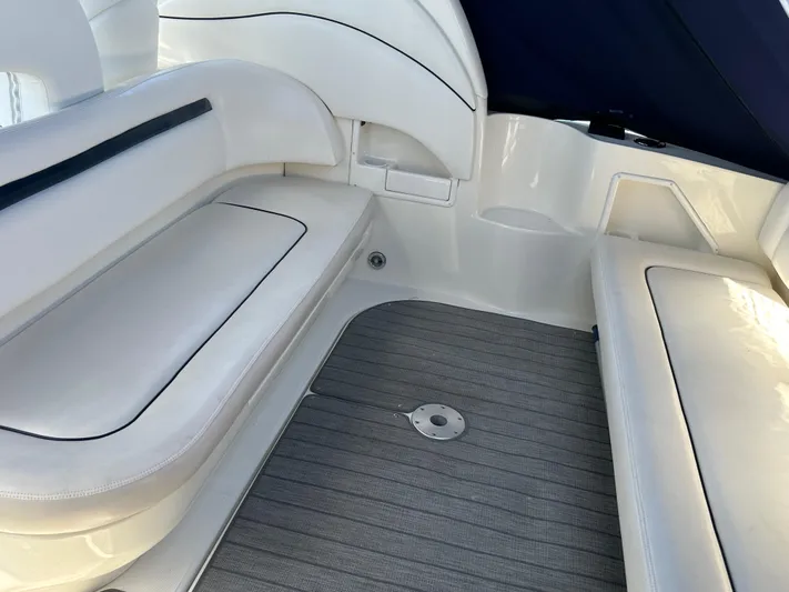 Yacht Photos Pics 2004 Sea Ray 360 Sundancer interior seating area with white cushions and gray flooring.