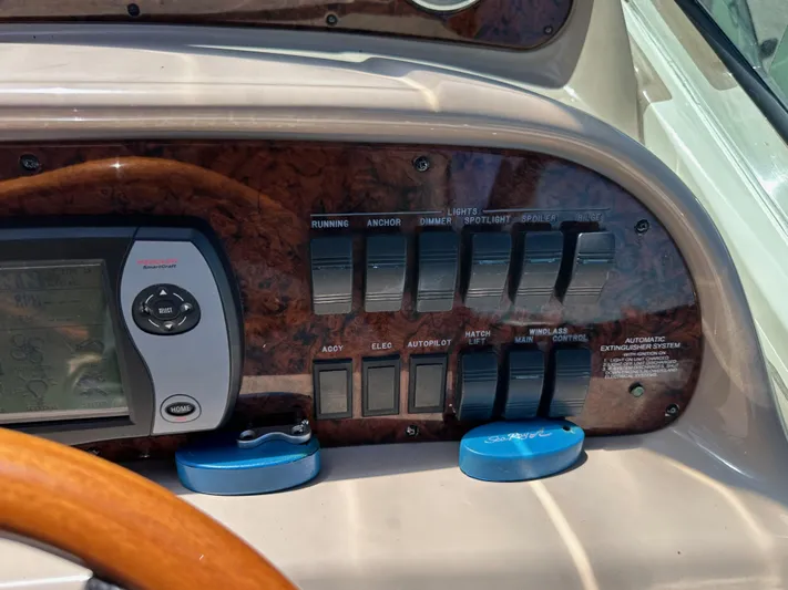  Yacht Photos Pics Control panel of a 2004 Sea Ray 360 Sundancer boat with switches and navigation display.