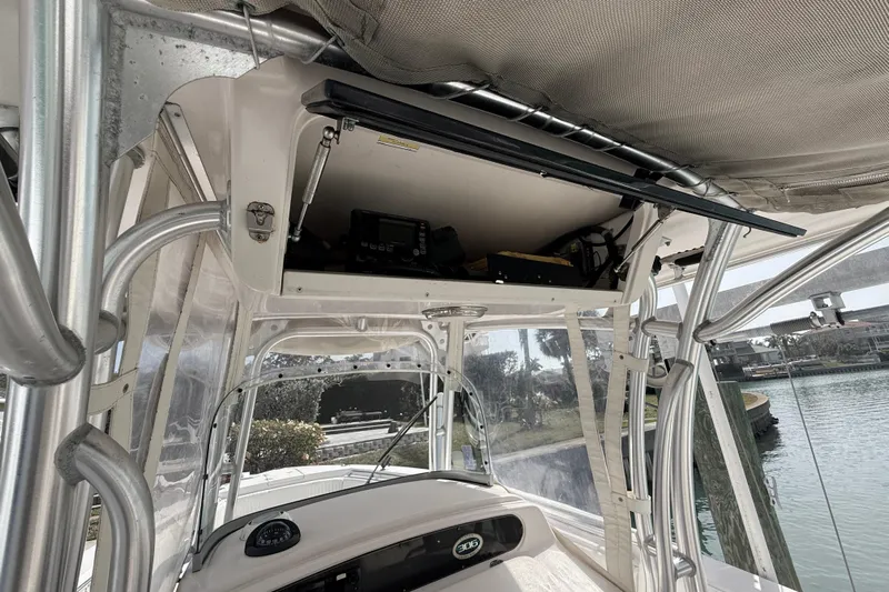  Yacht Photos Pics 2013 Grady-White Canyon 306 boat interior with electronics and canopy.