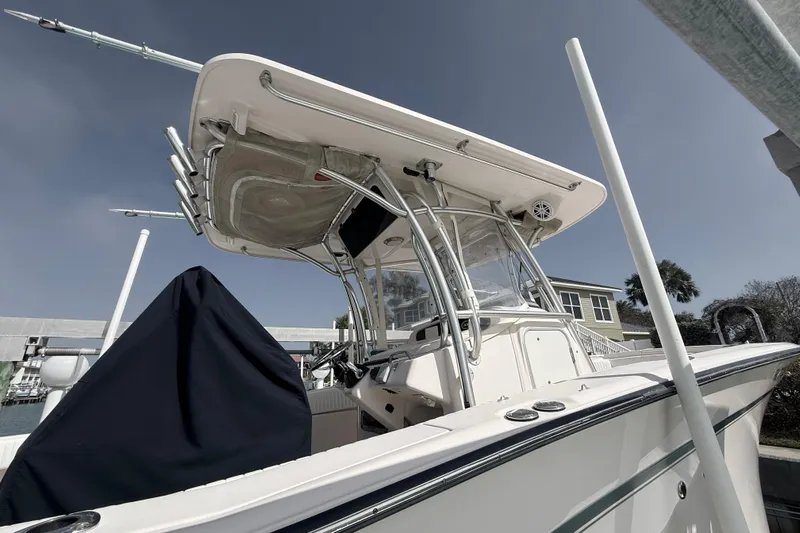  Yacht Photos Pics 2013 Grady-White Canyon 306 boat docked under clear sky.