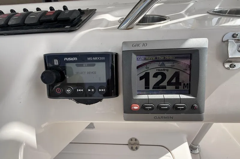  Yacht Photos Pics 2013 Grady-White Canyon 306 dashboard with Fusion MS-NRX300 and Garmin GHC 10 displays.