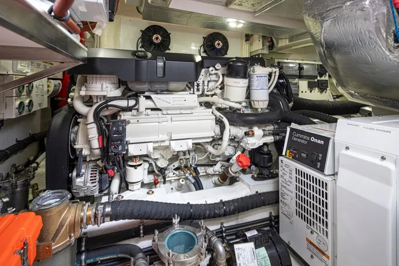 Lucky Dog Yacht Photos Pics Engine room of 2018 Riviera 4800 Sport Yacht with Cummins Onan generator and Volvo components.