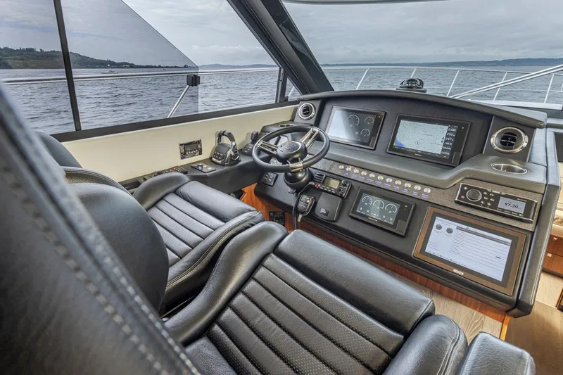 Lucky Dog Yacht Photos Pics Interior cockpit of 2018 Riviera 4800 Sport Yacht with advanced navigation systems.