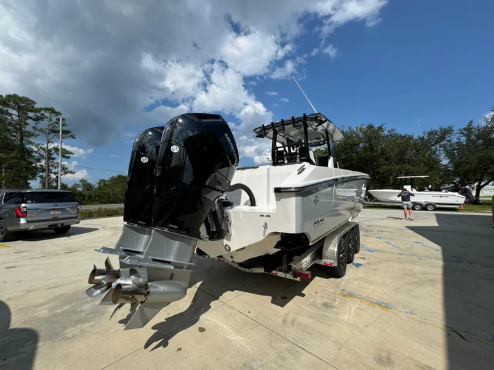  Yacht Photos Pics 2024 Fountain 32 NX boat with dual outboard motors on a trailer.