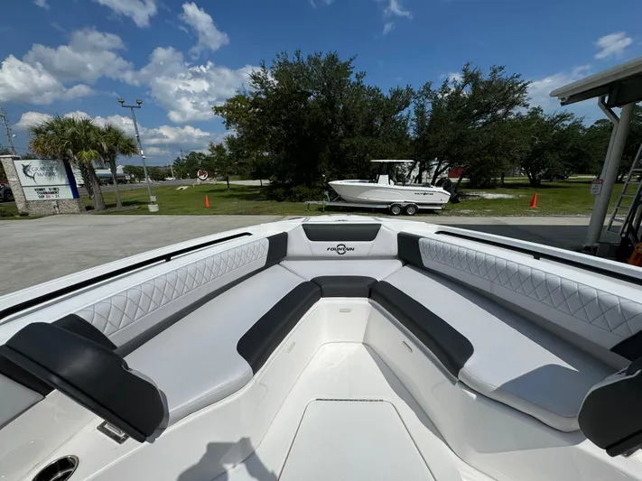  Yacht Photos Pics 2024 Fountain 32 NX boat interior with sleek seating and modern design.