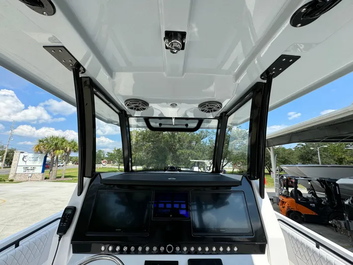  Yacht Photos Pics 2024 Fountain 32 NX boat dashboard with modern controls and navigation screens.