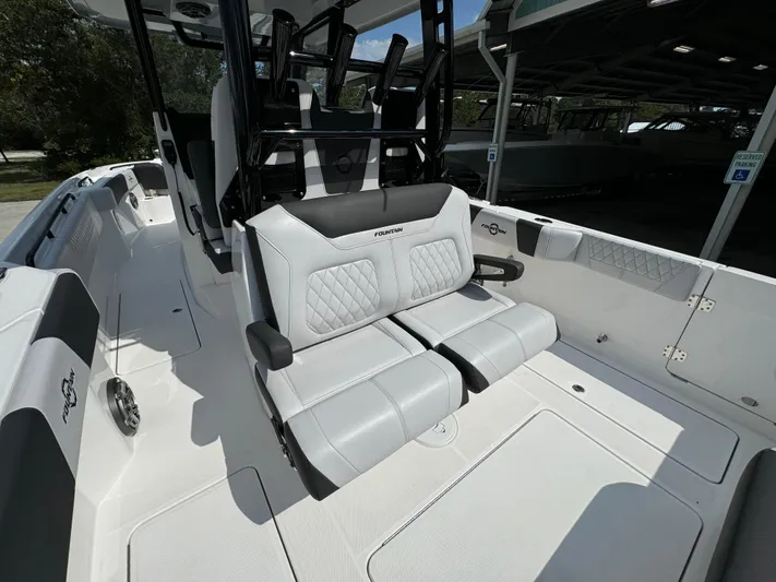  Yacht Photos Pics 2024 Fountain 32 NX boat interior with luxurious seating and modern design.