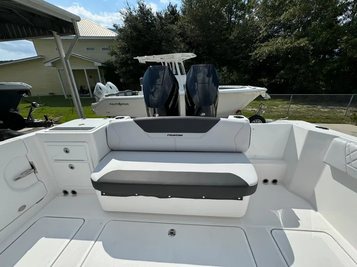  Yacht Photos Pics 2024 Fountain 32 NX boat interior with seating and dual engines.
