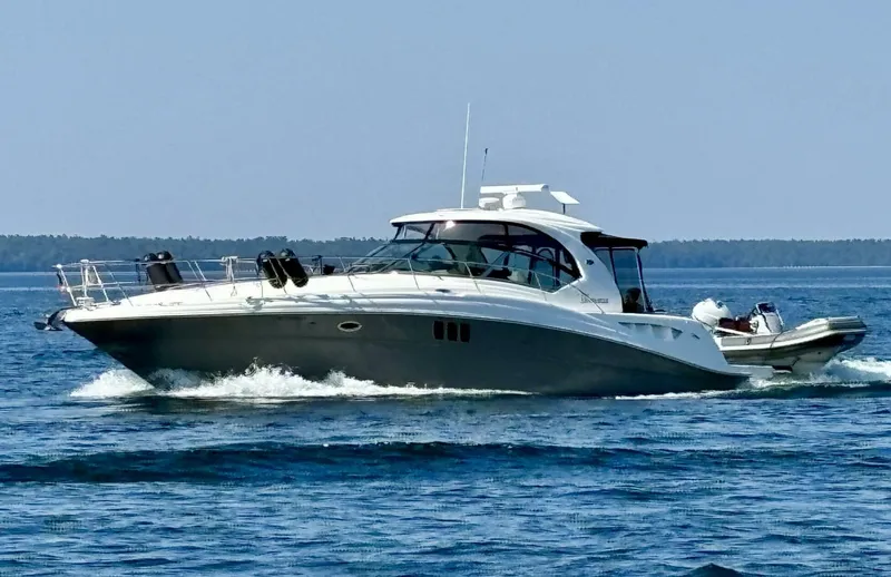  Yacht Photos Pics 2006 Sea Ray 44 Sundancer cruising on open water.