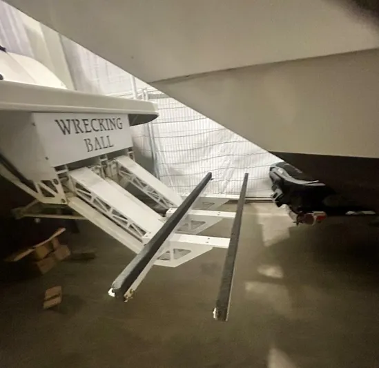  Yacht Photos Pics 2006 Sea Ray 44 Sundancer boat with "Wrecking Ball" name, docked indoors.