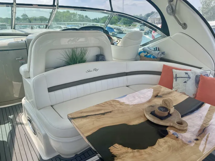  Yacht Photos Pics Luxurious 2006 Sea Ray 44 Sundancer yacht interior with elegant seating and stylish wooden table.