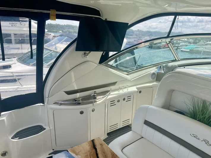 Yacht Photos Pics Interior of 2006 Sea Ray 44 Sundancer yacht with seating and kitchenette.